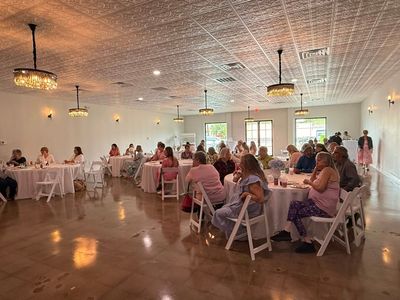 Guests seated together at a baby shower celebration