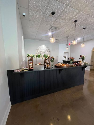 Grazing and charcuterie table set along the bar