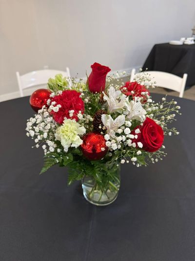 Red rose bouquet with baby's breath as a table centerpiece