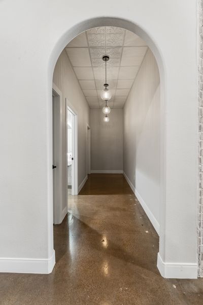 Hallway with arched entryway