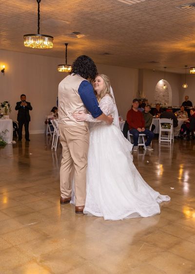 Bride and groom first dance with a dramatic fog effect